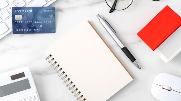 A close-up shot of a credit card with a calculator and a pen next to it, symbolizing financial planning and calculation.