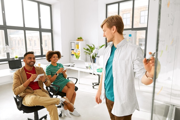 A person happily interacting with their primary care physician (PCP) in a modern doctor's office, highlighting the importance of the PCP within the HMO model.