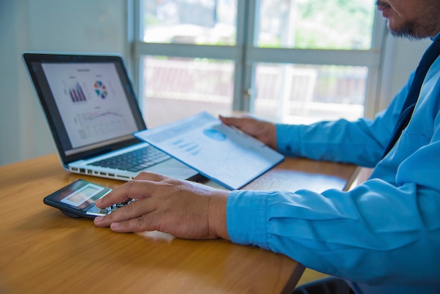 A person confidently managing their healthcare expenses on a laptop, showcasing the financial control and planning aspects of an HDHP paired with an HSA.
