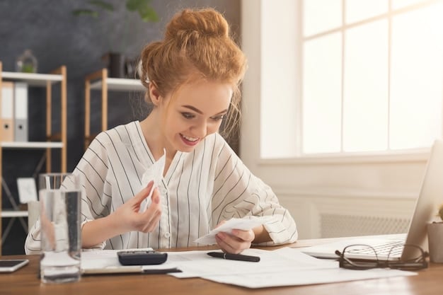 A person using a calculator and reviewing insurance documents, representing the careful cost assessment involved in deciding on voluntary benefits.
