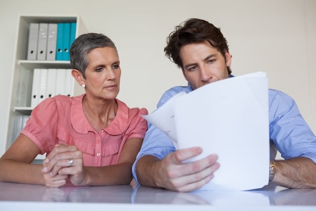 A family sitting at a table, reviewing documents related to health insurance and COBRA. They appear to be discussing their options and making informed decisions.