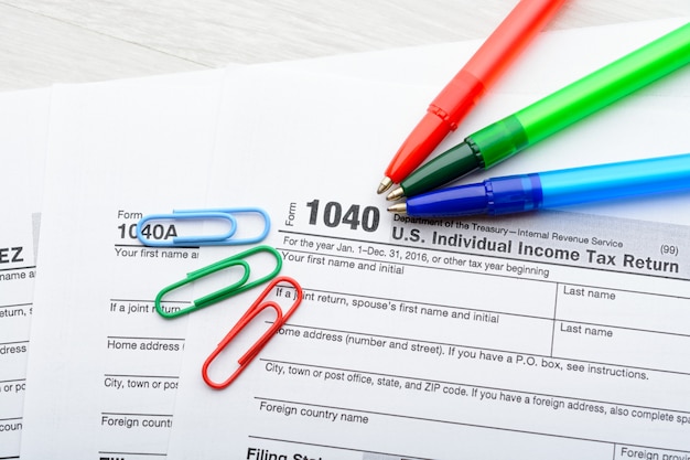 A close-up shot of a 1040 tax form with a highlighter marking the section for education credits. A calculator and pen are nearby, emphasizing the calculation and accuracy required for claiming the AOTC.