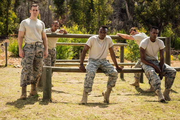 Cadets participating in a leadership training exercise, navigating an obstacle course while communicating effectively as a team.
